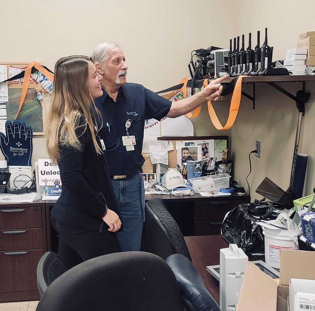 A student meets with maintenance at Saunders Medical Center 