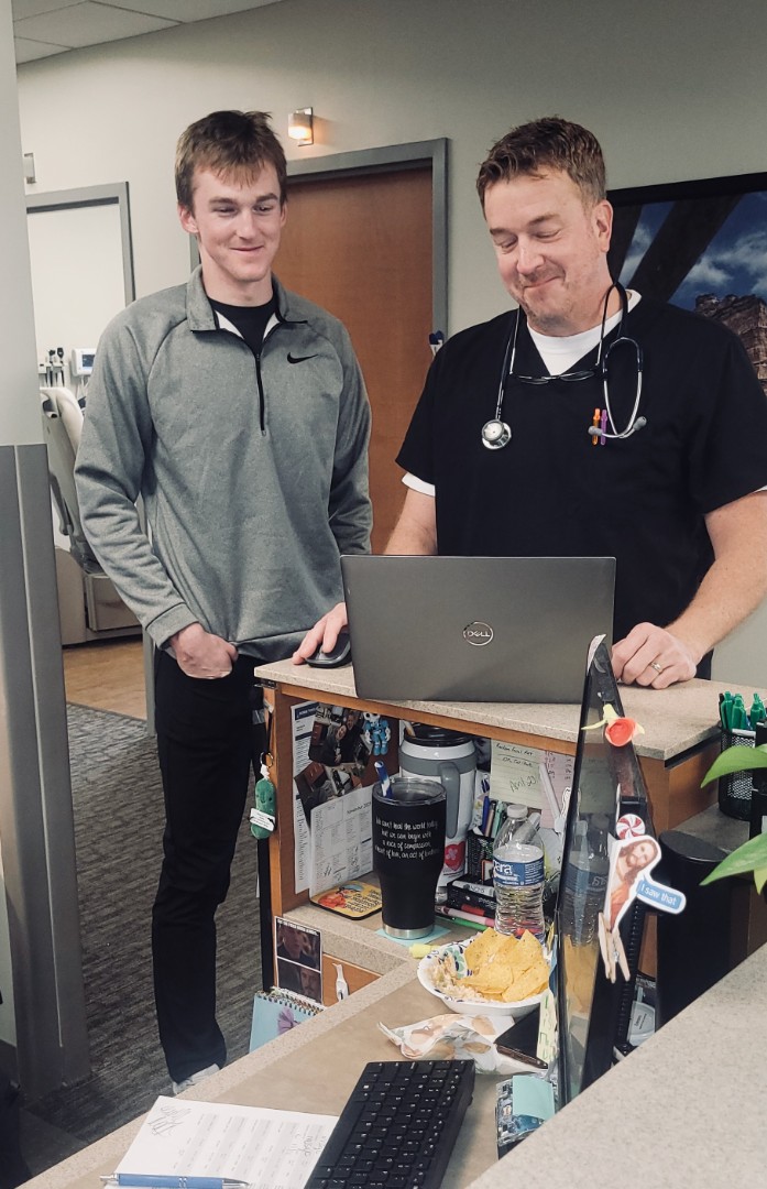 A student meets with a physician at Saunders Medical Center.